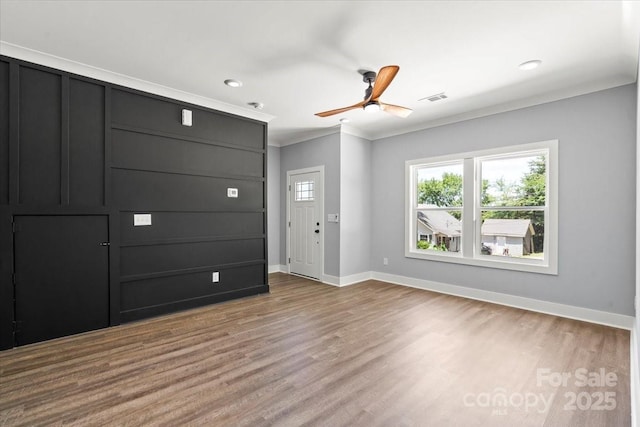 100 Boyette Dr Unit B, Albemarle, NC 28001 - unfurnished living room featuring a ceiling fan, wood finished floors, recessed lighting, and crown molding