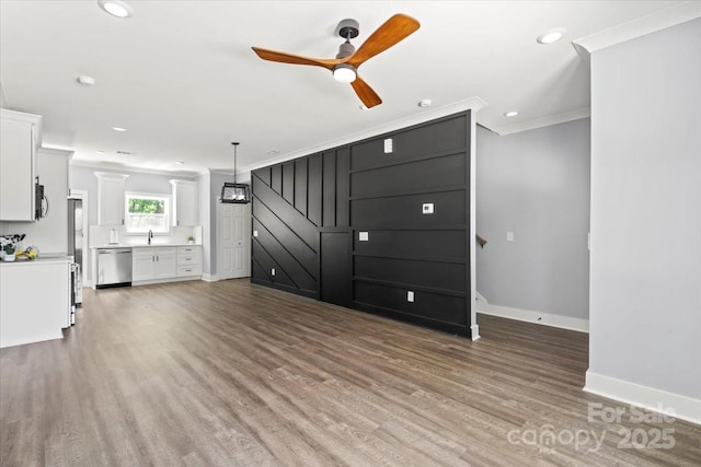 100 Boyette Dr Unit B, Albemarle, NC 28001 - unfurnished living room with crown molding, a ceiling fan, wood finished floors, and recessed lighting