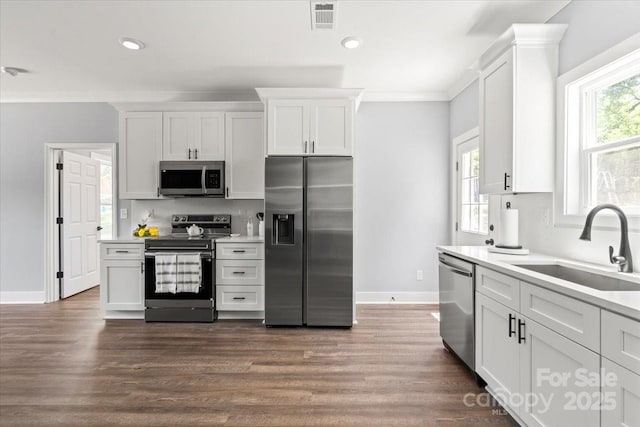 100 Boyette Dr Unit B, Albemarle, NC 28001 - kitchen featuring appliances with stainless steel finishes, light countertops, white cabinetry, dark wood-style flooring, and recessed lighting