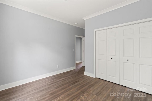 100 Boyette Dr Unit B, Albemarle, NC 28001 - unfurnished bedroom featuring ornamental molding, dark wood finished floors, and a closet