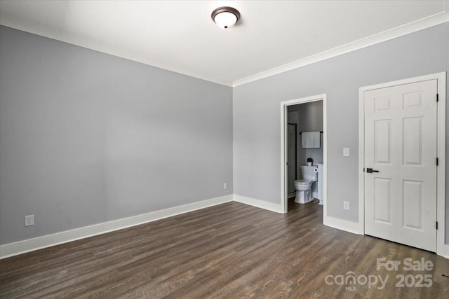 100 Boyette Dr Unit B, Albemarle, NC 28001 - unfurnished bedroom featuring dark wood-type flooring, crown molding, and ensuite bathroom