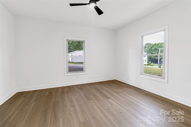 501 N Apple St Unit 103, Gastonia, NC 28054 - empty room with wood finished floors and a ceiling fan