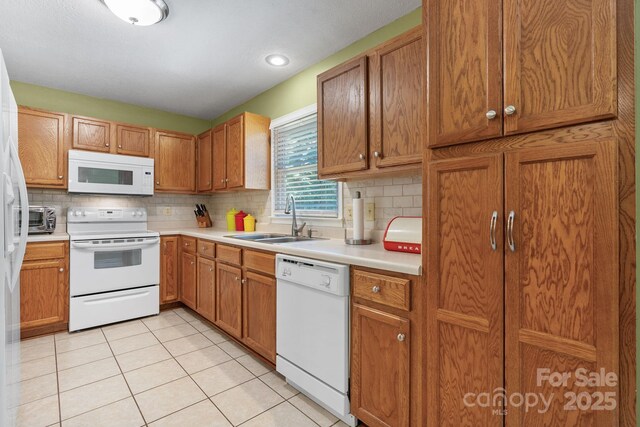 123 Clearwater Dr, Morganton, NC 28655 - kitchen featuring white appliances, backsplash, light countertops, and light tile patterned floors