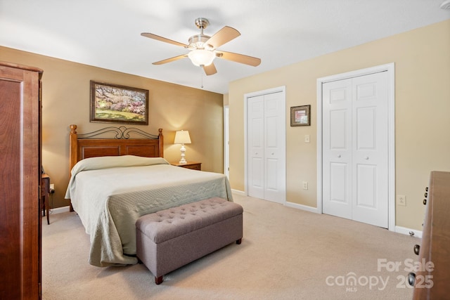 123 Clearwater Dr, Morganton, NC 28655 - bedroom with multiple closets, light colored carpet, and a ceiling fan