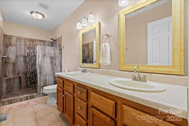 123 Clearwater Dr, Morganton, NC 28655 - bathroom with walk in shower, double vanity, a textured wall, tile patterned floors, and a textured ceiling