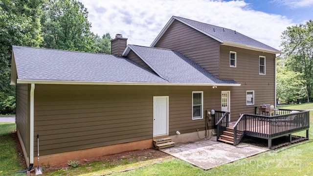 123 Clearwater Dr, Morganton, NC 28655 - back of house with a wooden deck, a chimney, a shingled roof, entry steps, and a patio area
