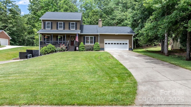 123 Clearwater Dr, Morganton, NC 28655 - colonial inspired home with a porch, a chimney, concrete driveway, and a front yard