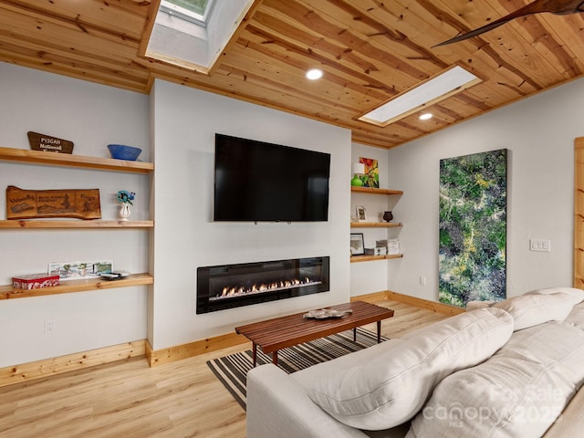 511 Emerald Mine Rd, Spruce Pine, NC 28777 - living room with a skylight, wood ceiling, a glass covered fireplace, wood finished floors, and recessed lighting