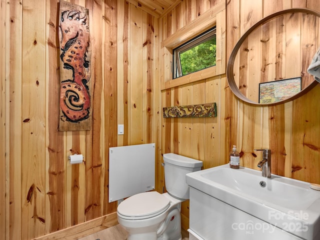 511 Emerald Mine Rd, Spruce Pine, NC 28777 - bathroom featuring wooden walls and vanity