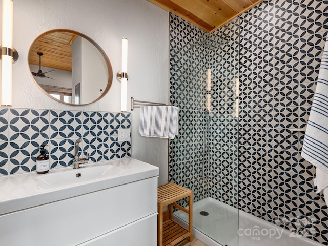 511 Emerald Mine Rd, Spruce Pine, NC 28777 - bathroom with wooden ceiling, a tile shower, vanity, and decorative backsplash
