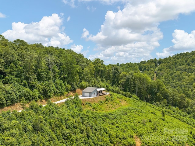 511 Emerald Mine Rd, Spruce Pine, NC 28777 - aerial view of property and surrounding area with a heavily wooded area