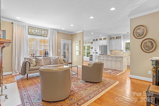 1902 4th Street Ct NW, Hickory, NC 28601 - living room with ornamental molding, recessed lighting, and light wood-type flooring