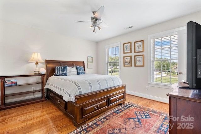 1902 4th Street Ct NW, Hickory, NC 28601 - bedroom with light wood-type flooring and a ceiling fan
