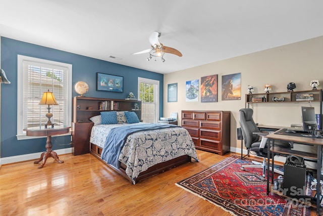 1902 4th Street Ct NW, Hickory, NC 28601 - bedroom featuring an office area, wood finished floors, and a ceiling fan