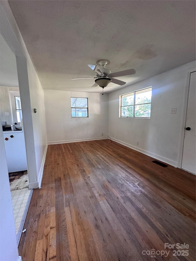 508 S Ave SW, Valdese, NC 28680 - unfurnished room with wood-type flooring, a ceiling fan, and healthy amount of natural light
