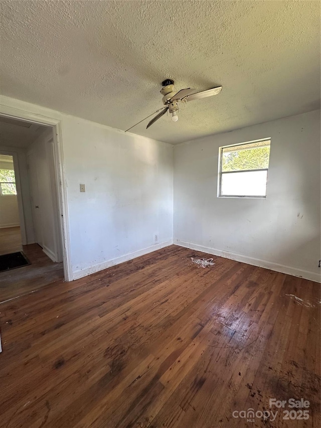 508 S Ave SW, Valdese, NC 28680 - spare room featuring hardwood / wood-style flooring, a ceiling fan, and a textured ceiling