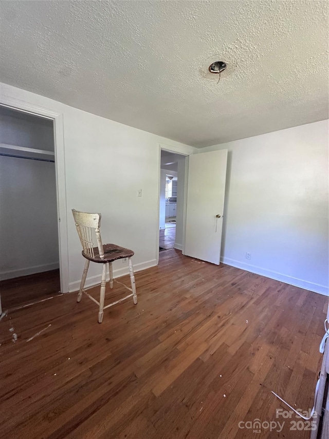 508 S Ave SW, Valdese, NC 28680 - unfurnished bedroom featuring wood finished floors and a textured ceiling