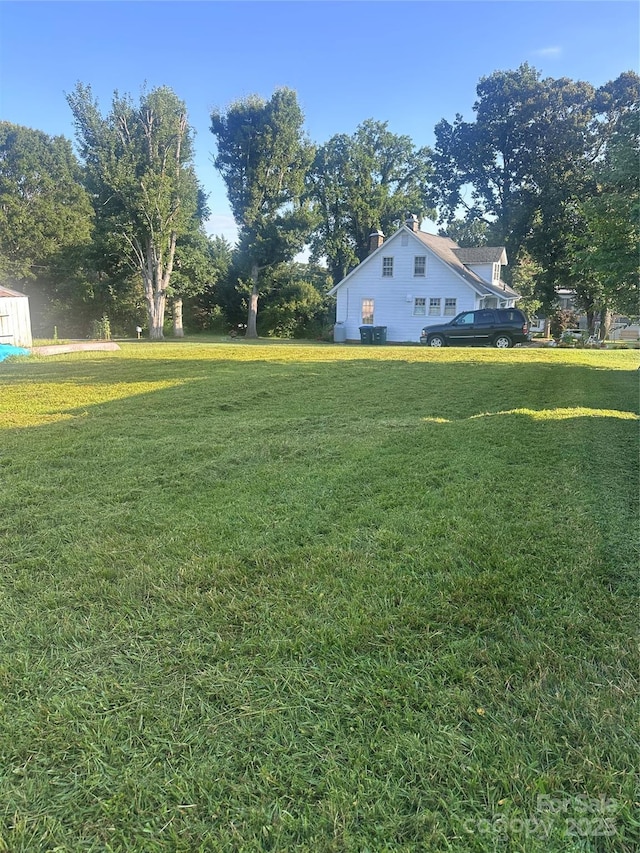 508 S Ave SW, Valdese, NC 28680 - view of green lawn featuring view of wooded area