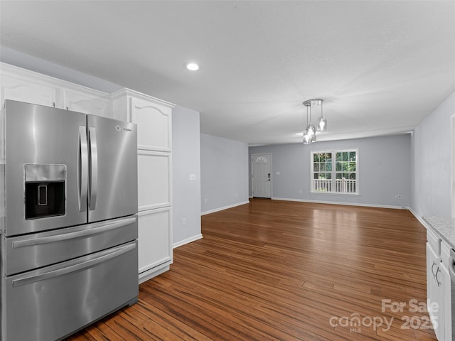 690 Mountain Rd, Hendersonville, NC 28791 - kitchen with stainless steel fridge with ice dispenser, white cabinets, wood finished floors, open floor plan, and recessed lighting
