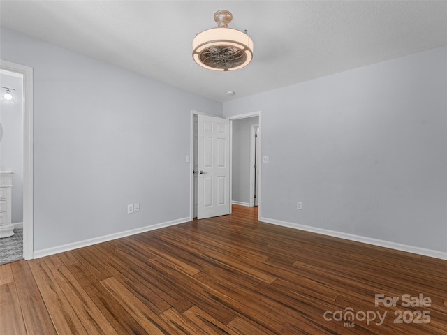690 Mountain Rd, Hendersonville, NC 28791 - unfurnished bedroom with wood finished floors and ensuite bathroom
