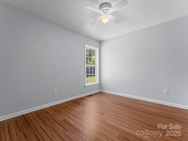 690 Mountain Rd, Hendersonville, NC 28791 - spare room featuring wood finished floors and a ceiling fan