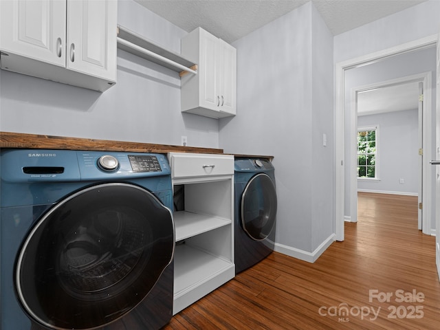 690 Mountain Rd, Hendersonville, NC 28791 - laundry area with wood finished floors and cabinet space