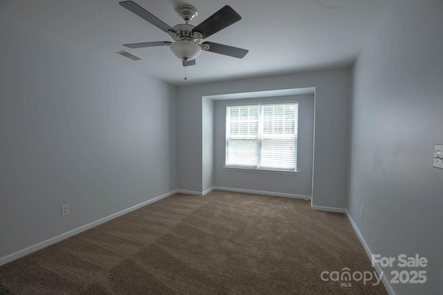 10011 Treeside Ln, Matthews, NC 28105 - carpeted spare room with baseboards and a ceiling fan