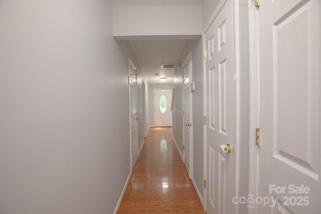 10011 Treeside Ln, Matthews, NC 28105 - corridor featuring baseboards and light wood-style flooring