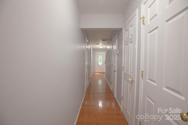 10011 Treeside Ln, Matthews, NC 28105 - hallway with baseboards and light wood-style floors