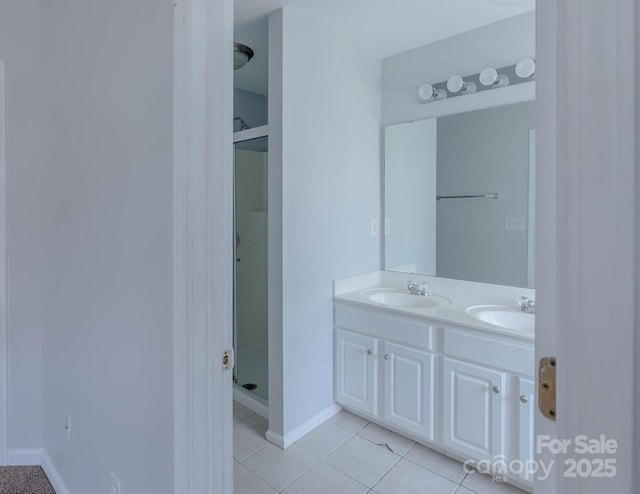 10011 Treeside Ln, Matthews, NC 28105 - bathroom featuring a shower stall, double vanity, and tile patterned floors
