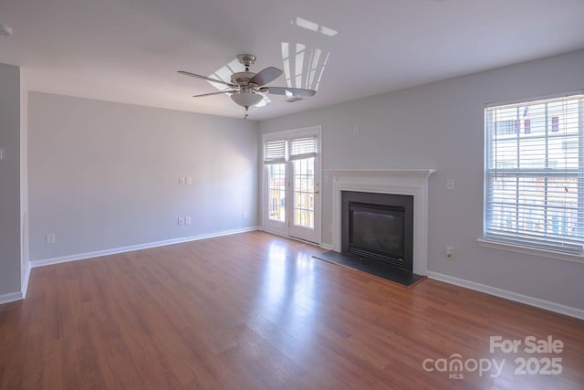10011 Treeside Ln, Matthews, NC 28105 - unfurnished living room featuring ceiling fan, a glass covered fireplace, and wood finished floors