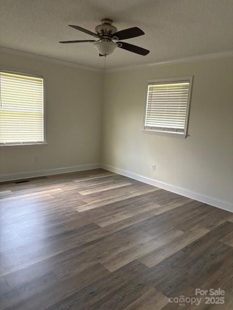 182 Redhawk Ln, Olin, NC 28660 - empty room with crown molding, dark wood-type flooring, a ceiling fan, and a textured ceiling