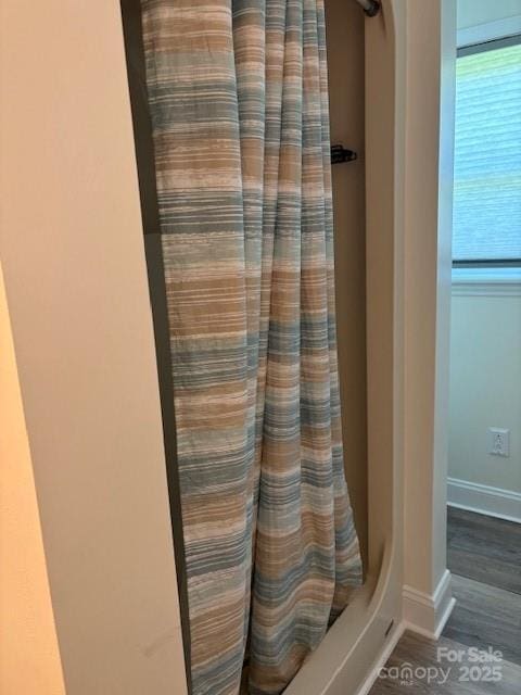 182 Redhawk Ln, Olin, NC 28660 - detailed view of wood finished floors and a shower with curtain