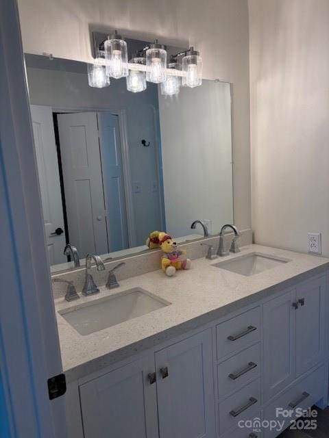 182 Redhawk Ln, Olin, NC 28660 - full bath with double vanity and a chandelier