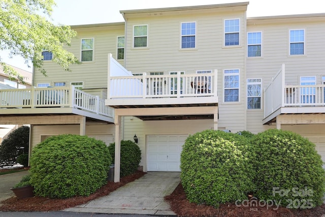 729 Naramore St, Davidson, NC 28036 - back of property with a garage, a balcony, and driveway
