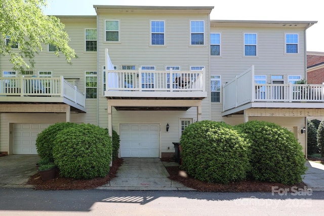 729 Naramore St, Davidson, NC 28036 - rear view of property with an attached garage and driveway