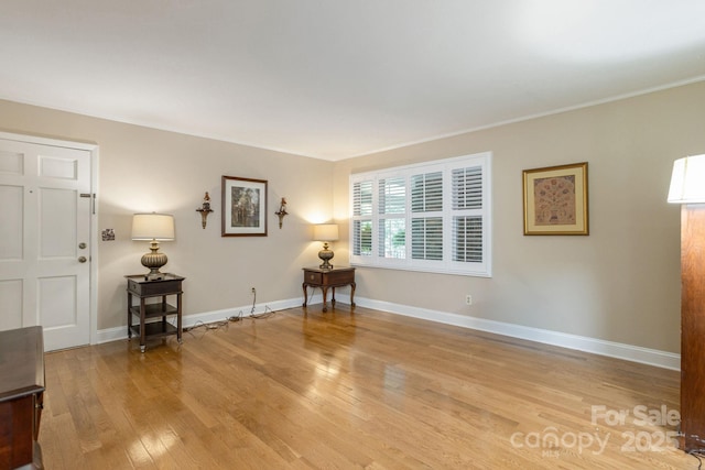 102 Boyd Dr Unit 7A, Flat Rock, NC 28731 - living area with light wood-style floors and ornamental molding