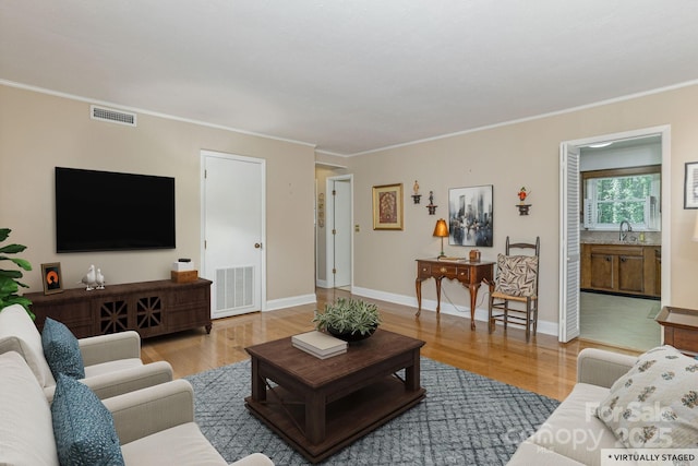 102 Boyd Dr Unit 7A, Flat Rock, NC 28731 - living area with light wood finished floors and ornamental molding