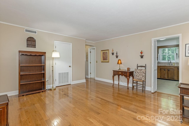 102 Boyd Dr Unit 7A, Flat Rock, NC 28731 - living room featuring light wood-style flooring and crown molding