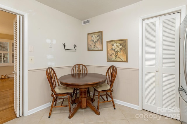102 Boyd Dr Unit 7A, Flat Rock, NC 28731 - dining area with a wainscoted wall and tile patterned floors