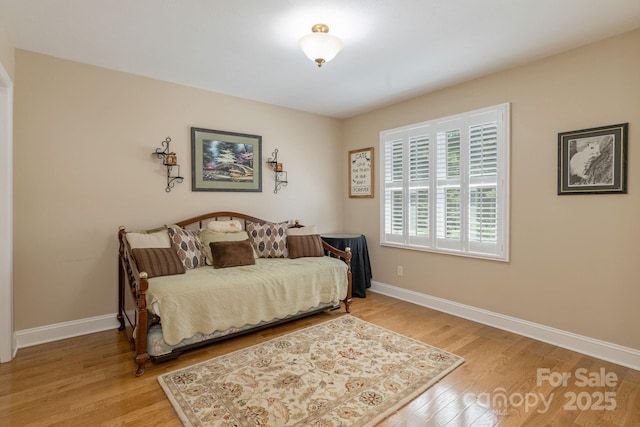 102 Boyd Dr Unit 7A, Flat Rock, NC 28731 - bedroom featuring wood finished floors and baseboards