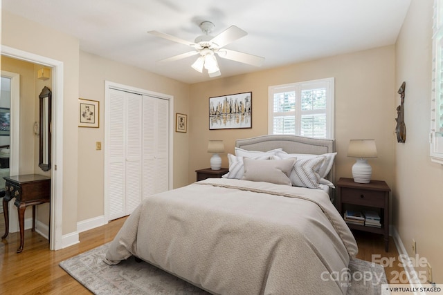 102 Boyd Dr Unit 7A, Flat Rock, NC 28731 - bedroom featuring a closet, light wood-type flooring, and a ceiling fan