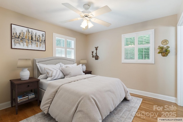 102 Boyd Dr Unit 7A, Flat Rock, NC 28731 - bedroom featuring light wood finished floors and a ceiling fan