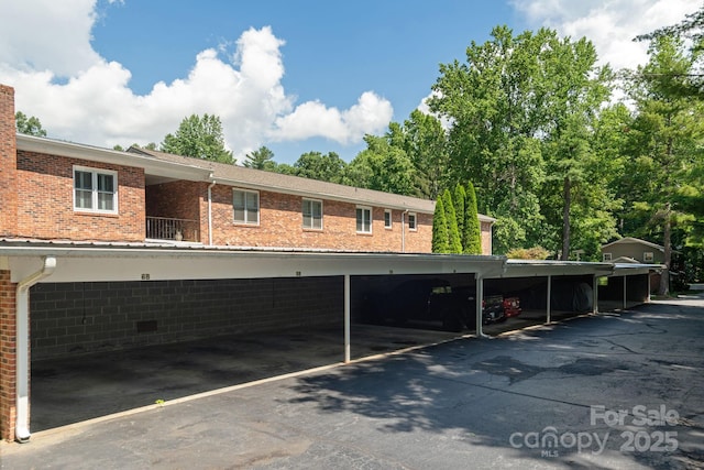 102 Boyd Dr Unit 7A, Flat Rock, NC 28731 - view of building exterior featuring covered parking
