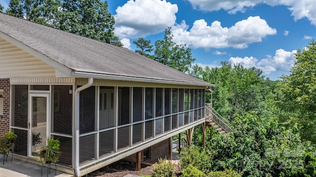 2066 Waterford Way, Morganton, NC 28655 - exterior view of a shingled roof, brick siding, a downspout, gutters, and stairs