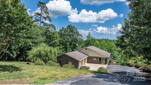 2066 Waterford Way, Morganton, NC 28655 - view of property exterior with driveway, a lawn, a garage, and a view of trees