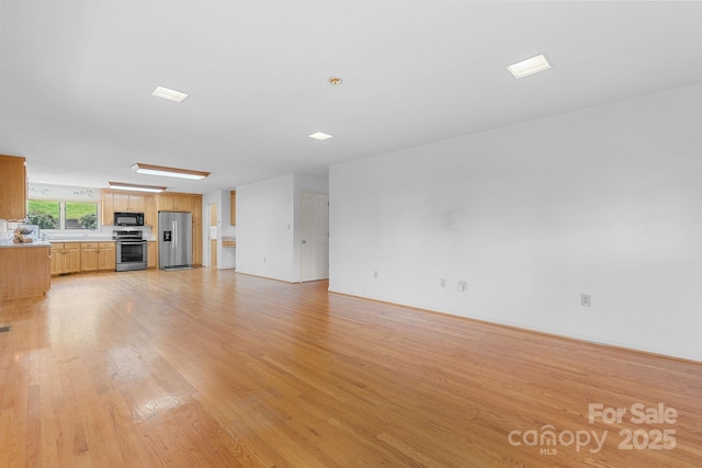 2066 Waterford Way, Morganton, NC 28655 - unfurnished living room featuring light wood-style flooring