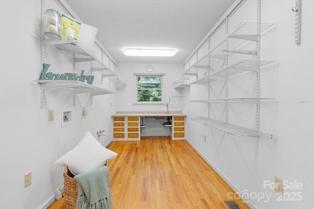2066 Waterford Way, Morganton, NC 28655 - walk in closet with wood finished floors and built in study area