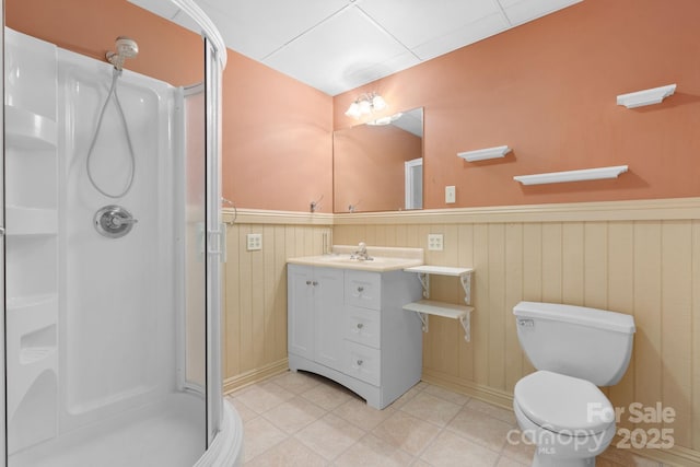 2066 Waterford Way, Morganton, NC 28655 - bathroom featuring a stall shower, vanity, wainscoting, and tile patterned floors