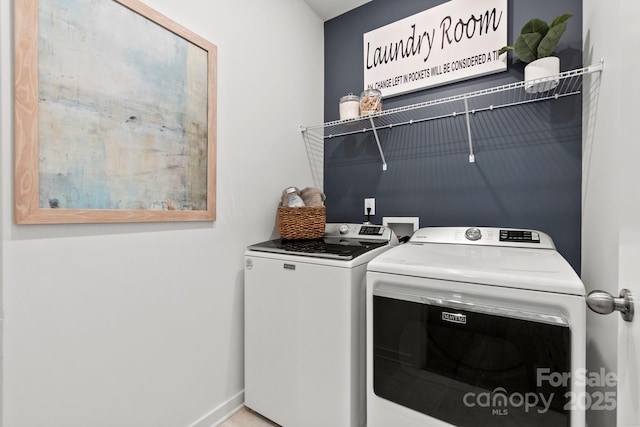 2589 Blue Sky Meadows Dr, Monroe, NC 28110 - laundry area with washer and dryer and baseboards